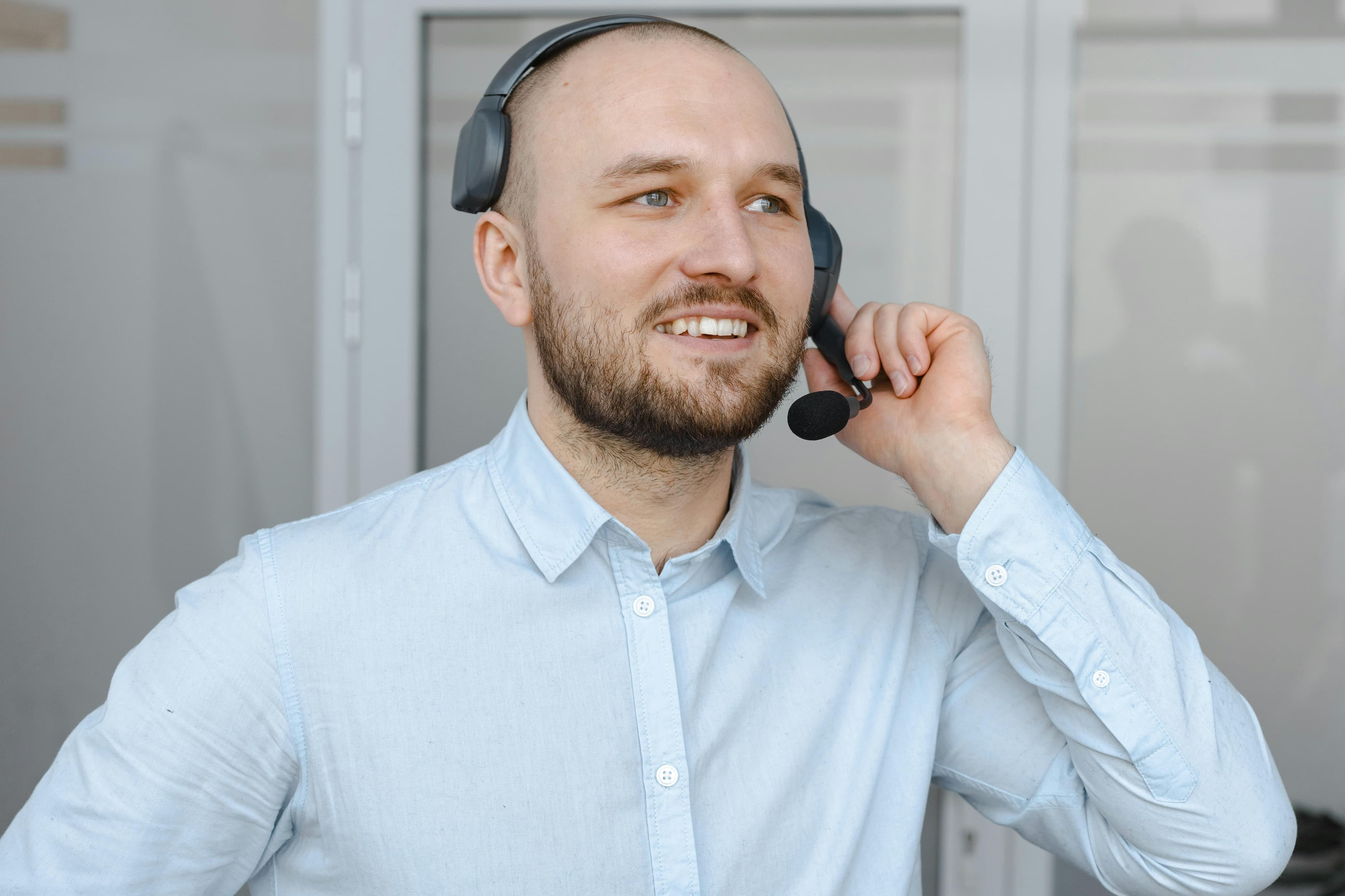 A receptionist on the phone, representing the booking-to-show-up conversion step.